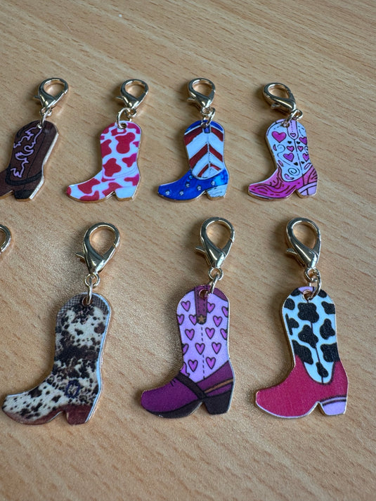 Mini clip-on cowboy boot keyrings in assorted colourful designs, shown upright
